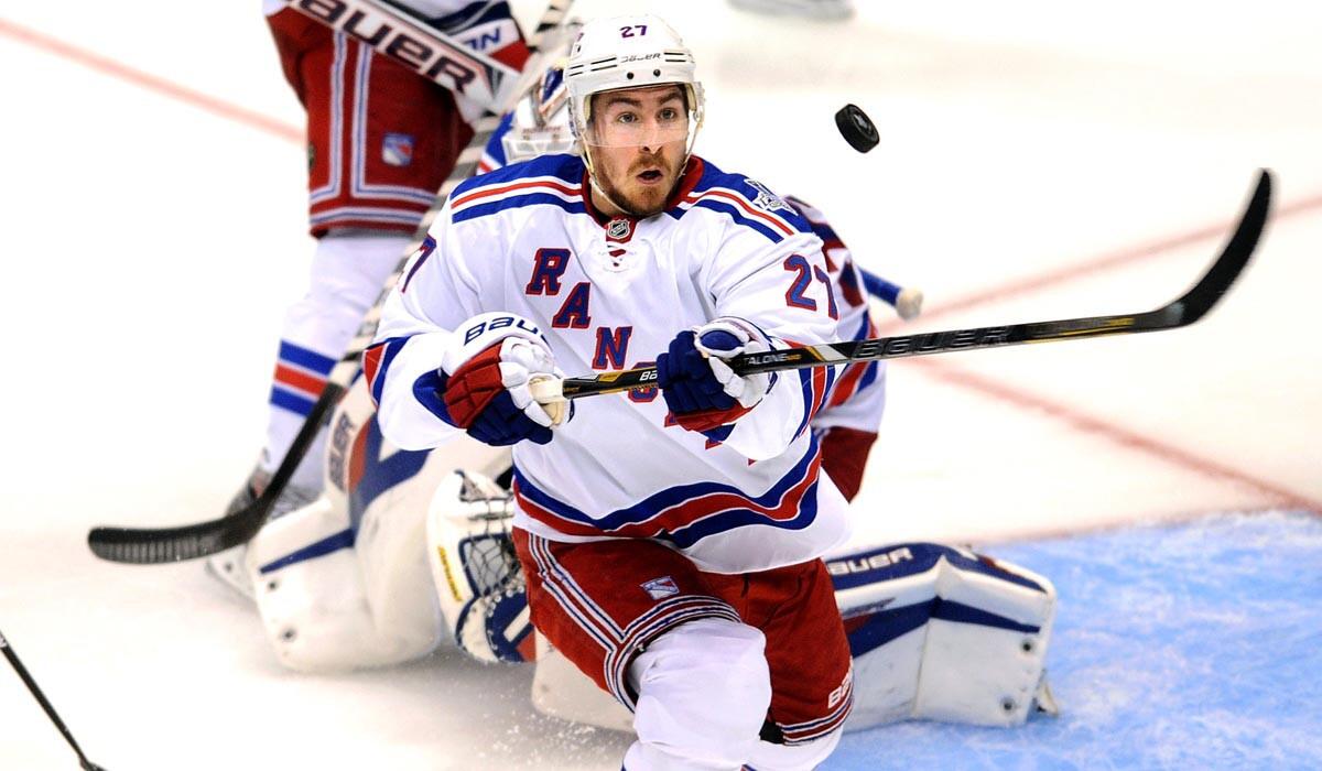 Rangers defenseman Ryan McDonagh tries to bring the puck back to the ice during Game 1 against the Kings on Wednesday at Staples Center.