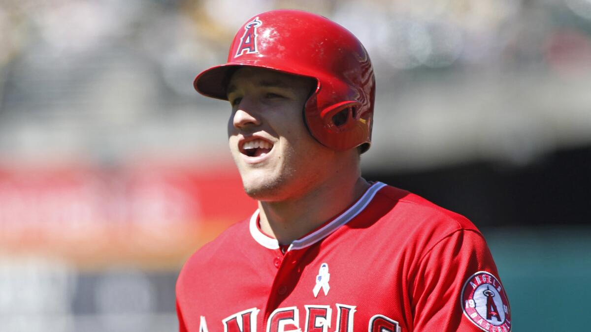 Angels slugger Mike Trout runs toward the dugout during a loss to the Oakland Athletics on Sunday.