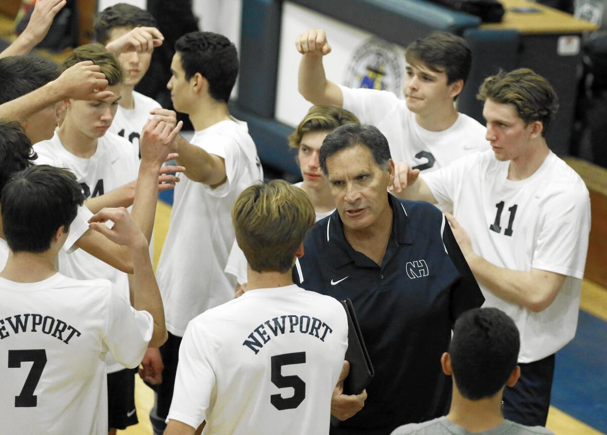 Newport Harbor High Coach Rocky Ciarelli talks to his team during a timeout against Capistrano Valley.