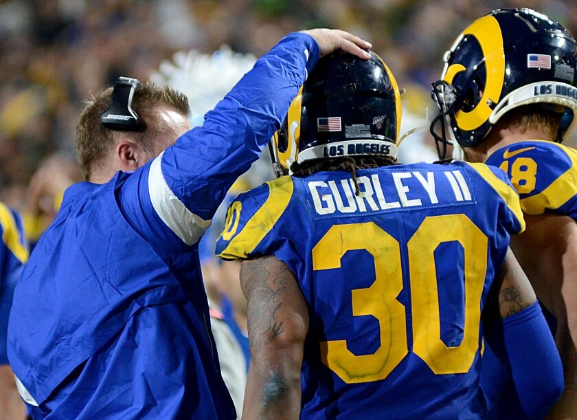Rams coach Sean McVay congratulates running back Todd Gurley.