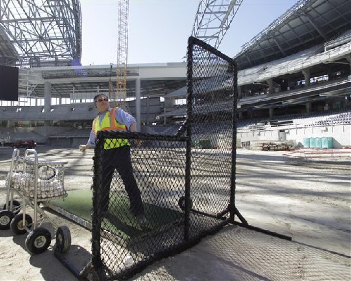 Marlins install 1st seat at new Miami ballpark - The San Diego