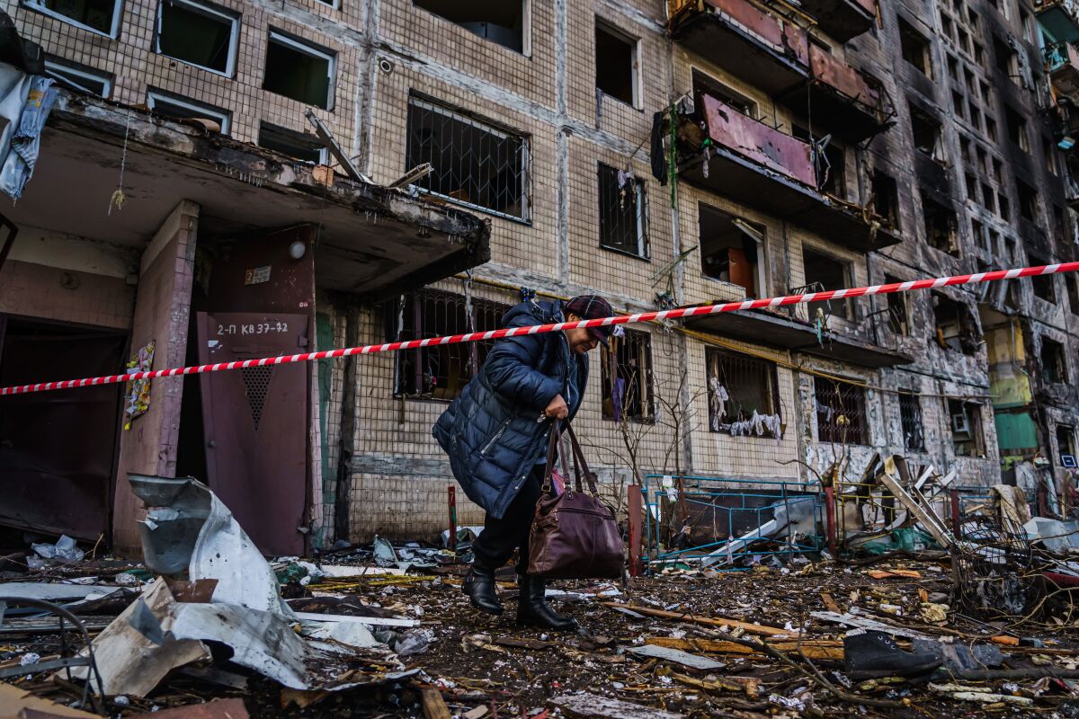 Residents evacuate their apartment building in Irpin, Ukraine. 