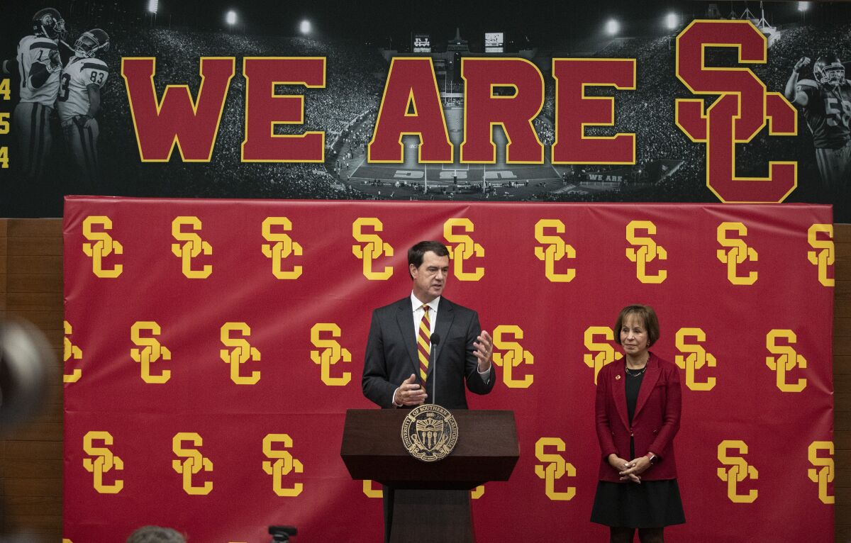 Mike Bohn, with USC President Carol L. Folt, speaks at his introductory conference at USC.