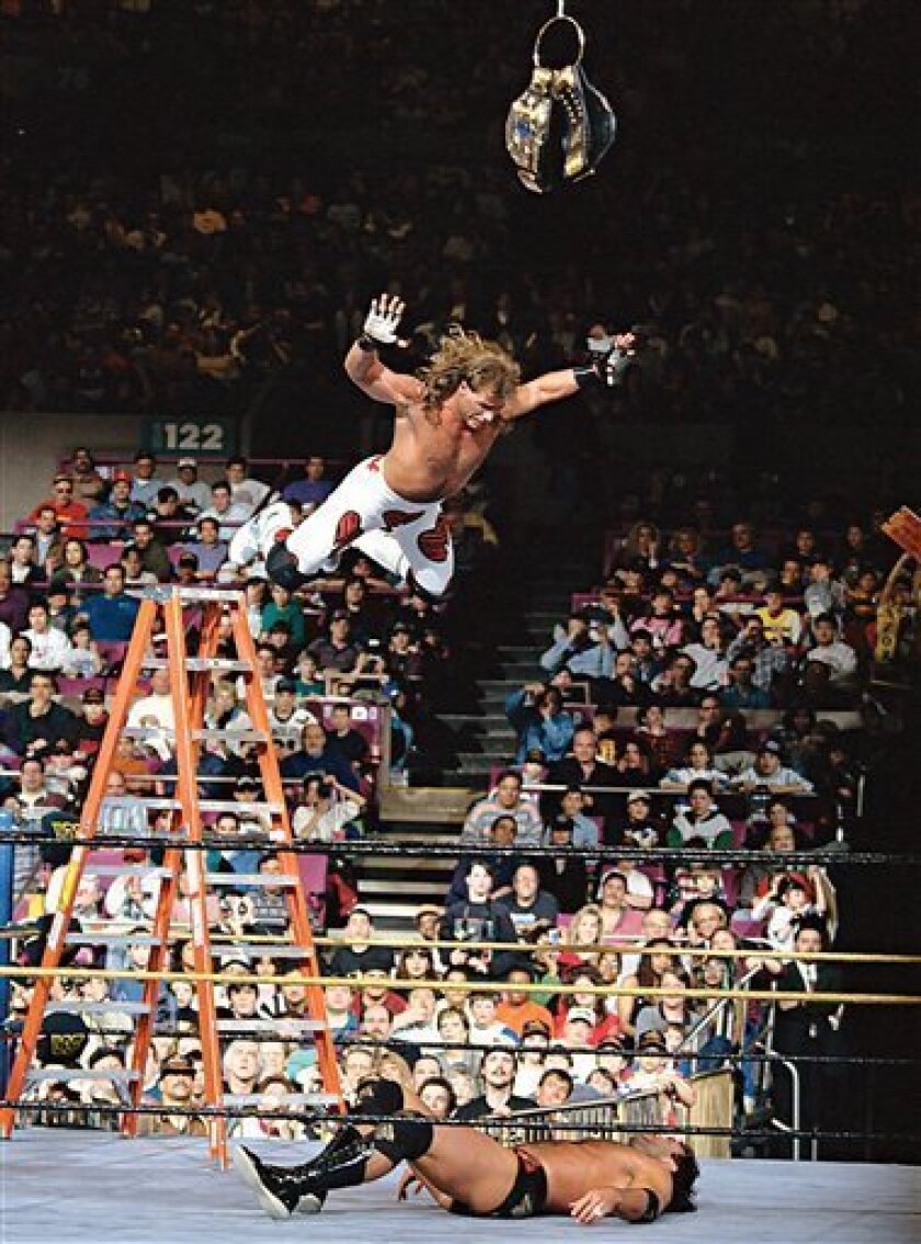 In this image released by the World Wrestling Entertainment, Inc., Shawn Michaels prepares to splash Razor Ramon in a ladder match at WrestleMania X on March 20, 1994 at Madison Square Garden in New York. (AP Photo/2009 World Wrestling Entertainment, Inc.)