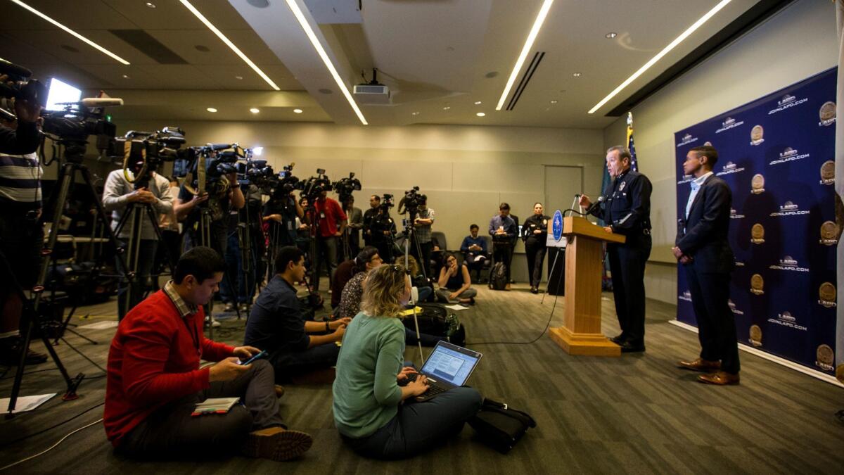 LAPD Assistant Chief Michel Moore addresses a room full of reporters Tuesday at the department's downtown headquarters.