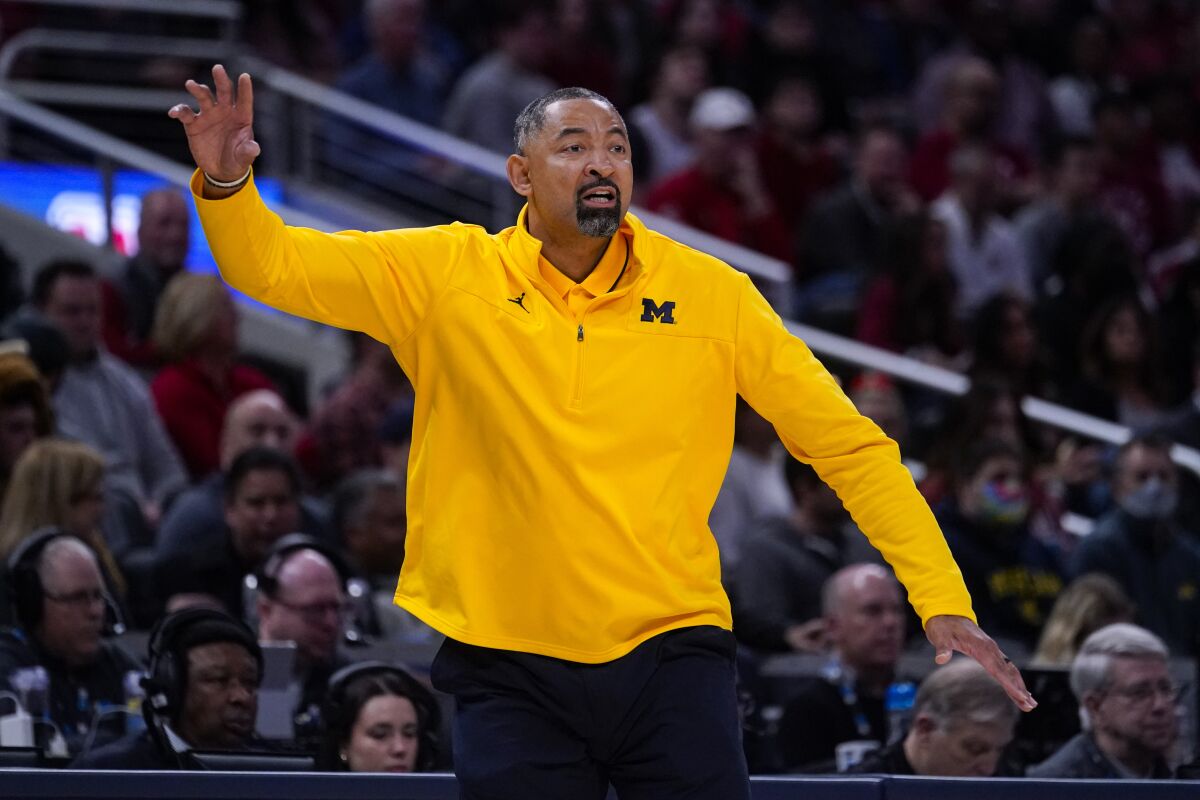 Michigan head coach Juwan Howard gestures in the first half of an NCAA college basketball game against Indiana at the Big Ten Conference tournament in Indianapolis, Thursday, March 10, 2022. (AP Photo/Michael Conroy)