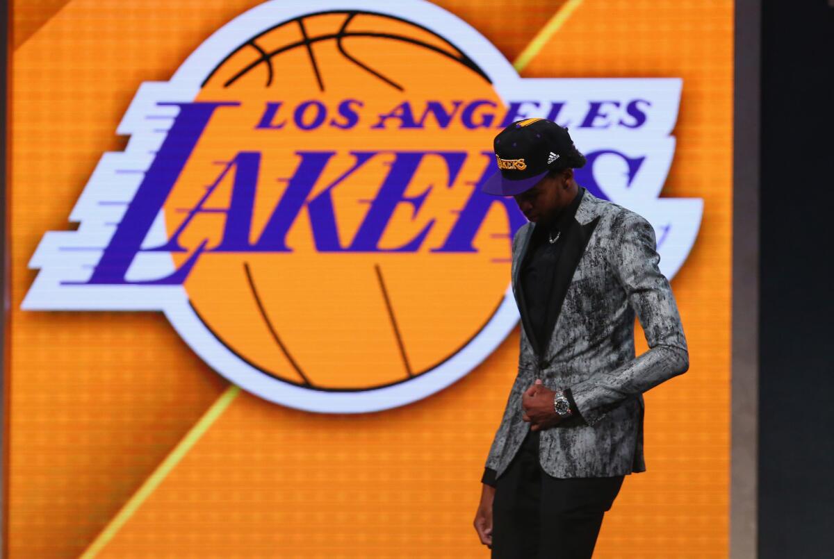 Brandon Ingram walks off stage after being drafted second overall by the Lakers in the 2016 NBA Draft.
