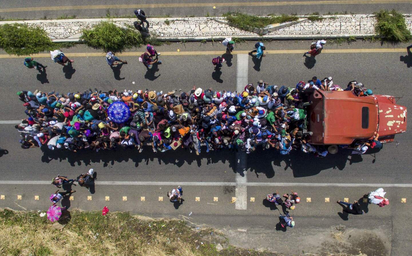 Aerial view of Honduran migrants aboard a truck as they take part in the caravan on the outskirts of Tapachula, Mexico.