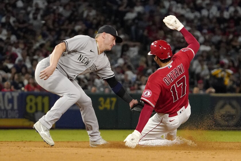 Angels' Shohei Ohtani is tagged out at second by New York Yankees third baseman Josh Donaldson.