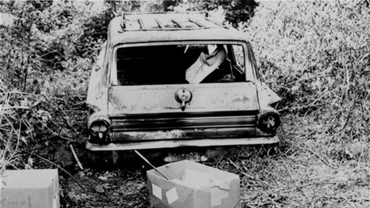 This June 24, 1964, photo shows the burned station wagon of Michael Schwerner, Andrew Goodman and James Chaney in a swampy area near Philadelphia, Miss. The bodies of the men were found later in an earthen dam.