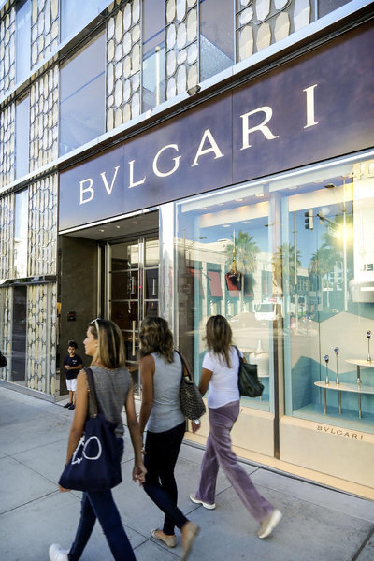 Shoppers pass the Bvlgari boutique, one of the sites participating in the Rodeo Drive Festival of Watches.