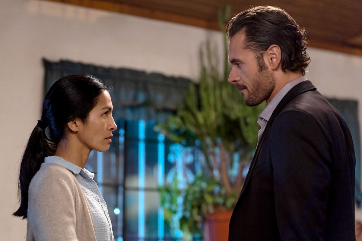 Elodie Yung and Adan Canto in "The Cleaning Lady" on Fox.