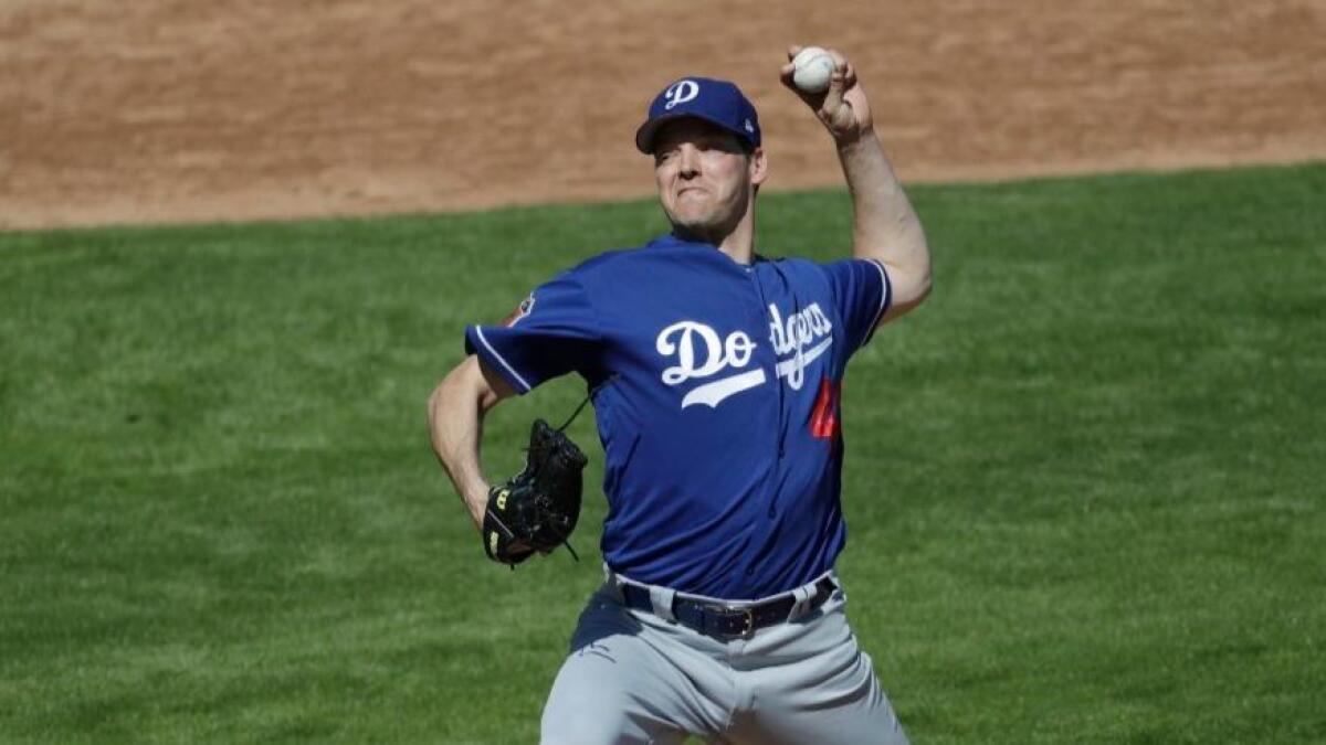Dodgers pitcher Rich Hill works against the Brewers during a spring training game on Feb. 26.