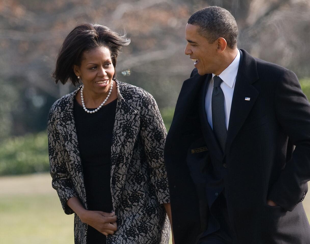 First Lady Michelle Obama, with President Obama, is dressed in traditional somber attire for the funeral of Vice President Joe Biden's mother in 2010, but she also shows off a new bobbed hairstyle.