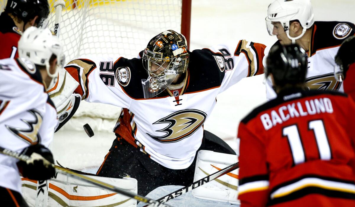 Ducks goalie John Gibson makes a save against the Flames in the first period Friday night in Calgary.