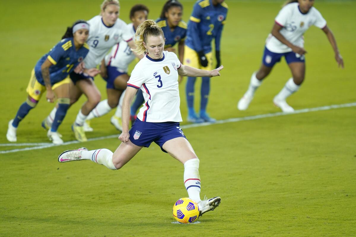 United States midfielder Samantha Mewis (3) scores a goal on a penalty kick.