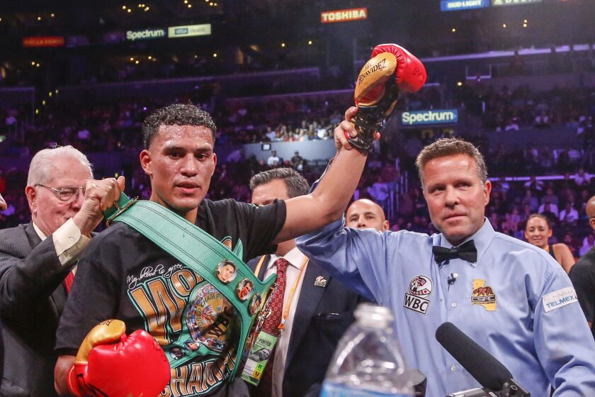 David Benavidez, left, celebrates after his victory over Anthony Dirrell during the WBC World Super Middleweight Championship boxing match Saturday, Sept. 28, 2019, in Los Angeles. (AP Photo/Ringo H.W. Chiu)