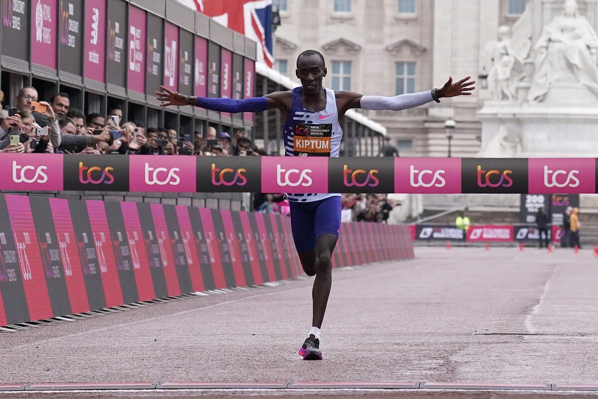 Kelvin Kiptum of Kenya crosses the finish line to win the men's race at the London Marathon.