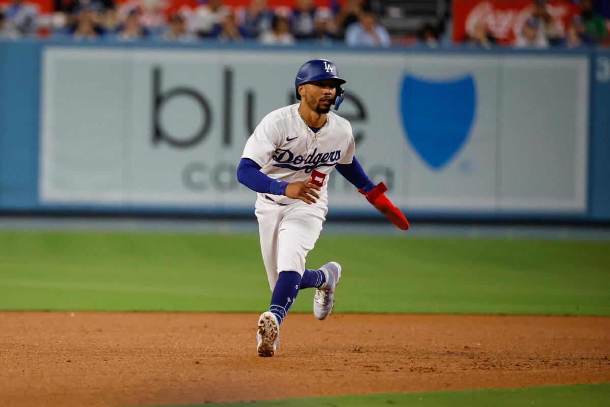 Mookie Betts leads off first base against the Colorado Rockies at Dodger Stadium on Friday night.