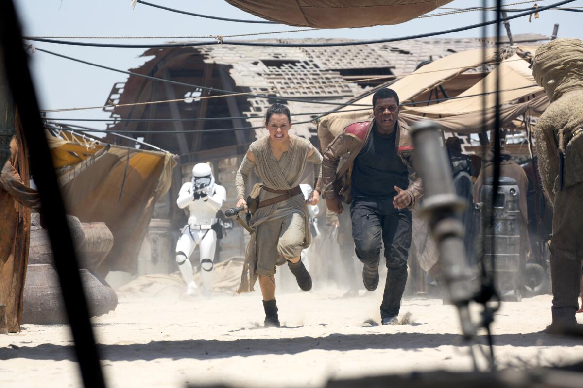 Rey (Daisy Ridley) and Finn (John Boyega) in "Star Wars: The Force Awakens."