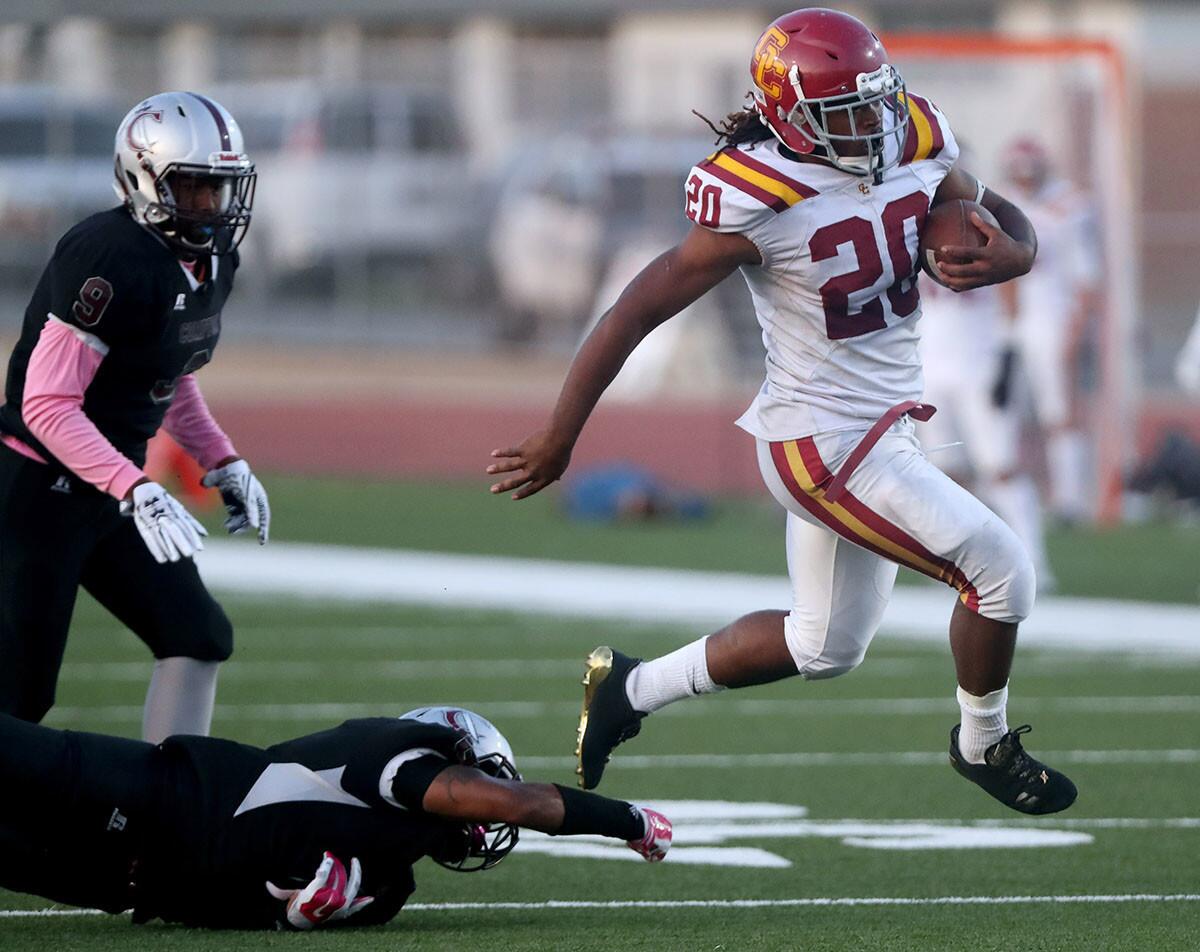 Glendale College football player #20 Adayus Robertson avoids the tackle in game vs. Compton College in Compton on Saturday, Oct. 13, 2018.