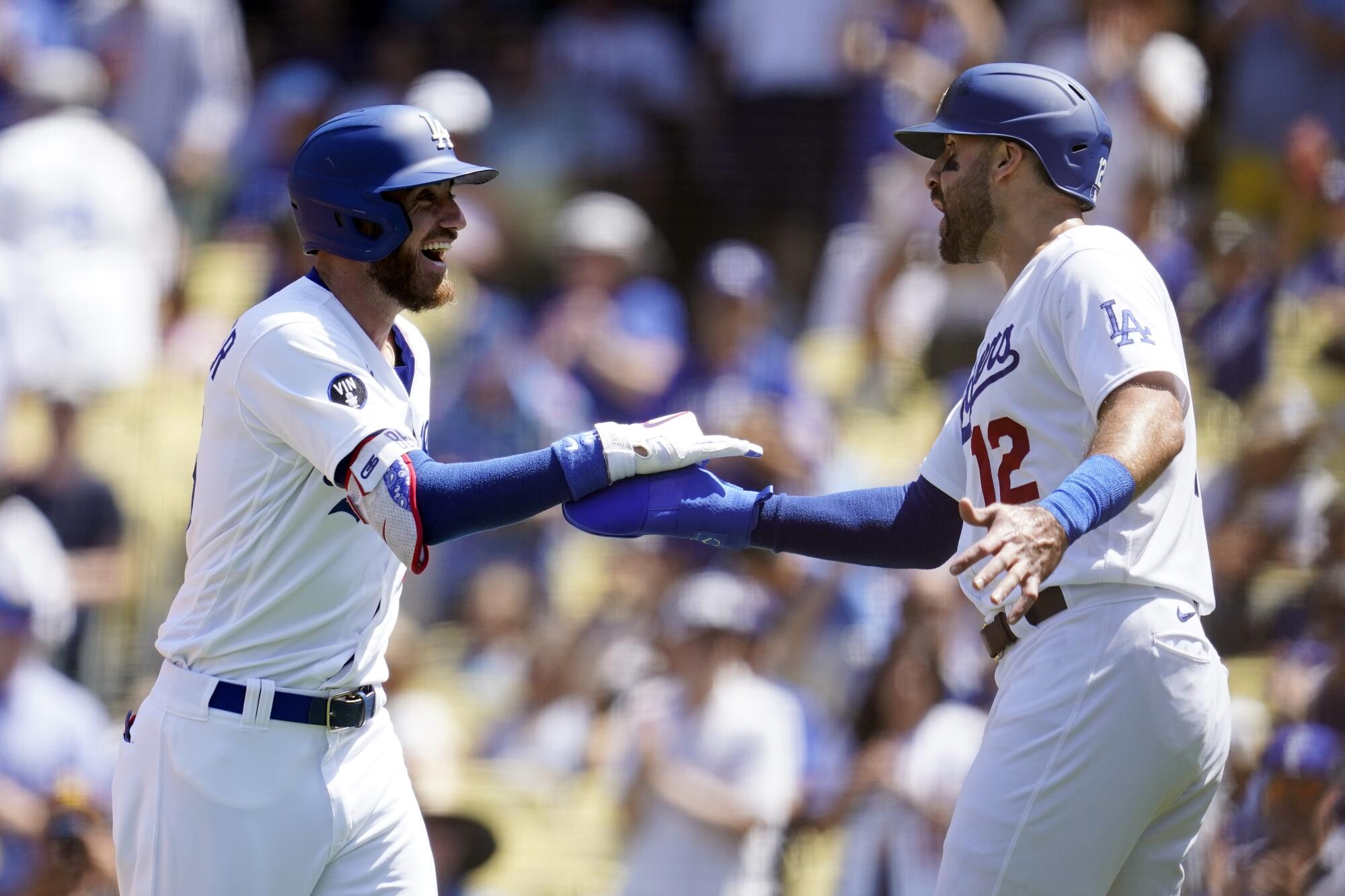 Cody Bellinger, left, celebrates with teammate Joey Gallo after hitting a two-run home run.