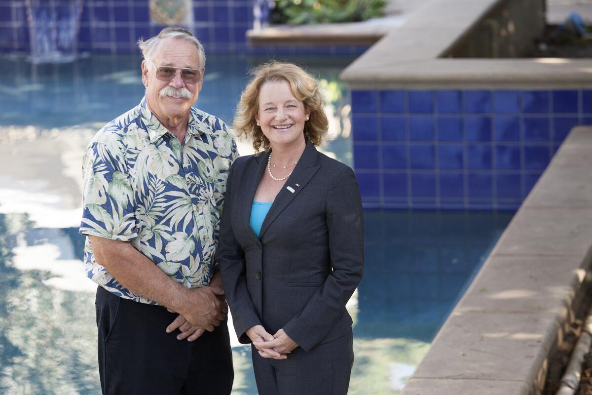 School board Trustee Katrina Foley, right, and former Councilman Jay Humphrey pose for a portrait at Foley's home in Costa Mesa on Wednesday. Foley remains solid atop the field of eight candidates in the Costa Mesa City Council election. Humphrey has the third most votes, slightly trailing Mayor Jim Righeimer.