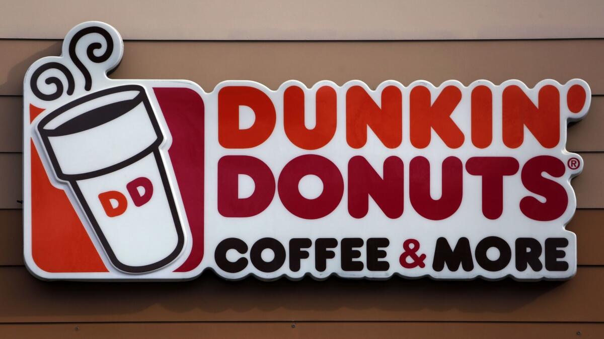 The Dunkin' Donuts logo on a shop in Mount Lebanon, Pa. Doughnuts are still on the menu, but the company is renaming itself "Dunkin" to reflect its increasing emphasis on coffee and other drinks.