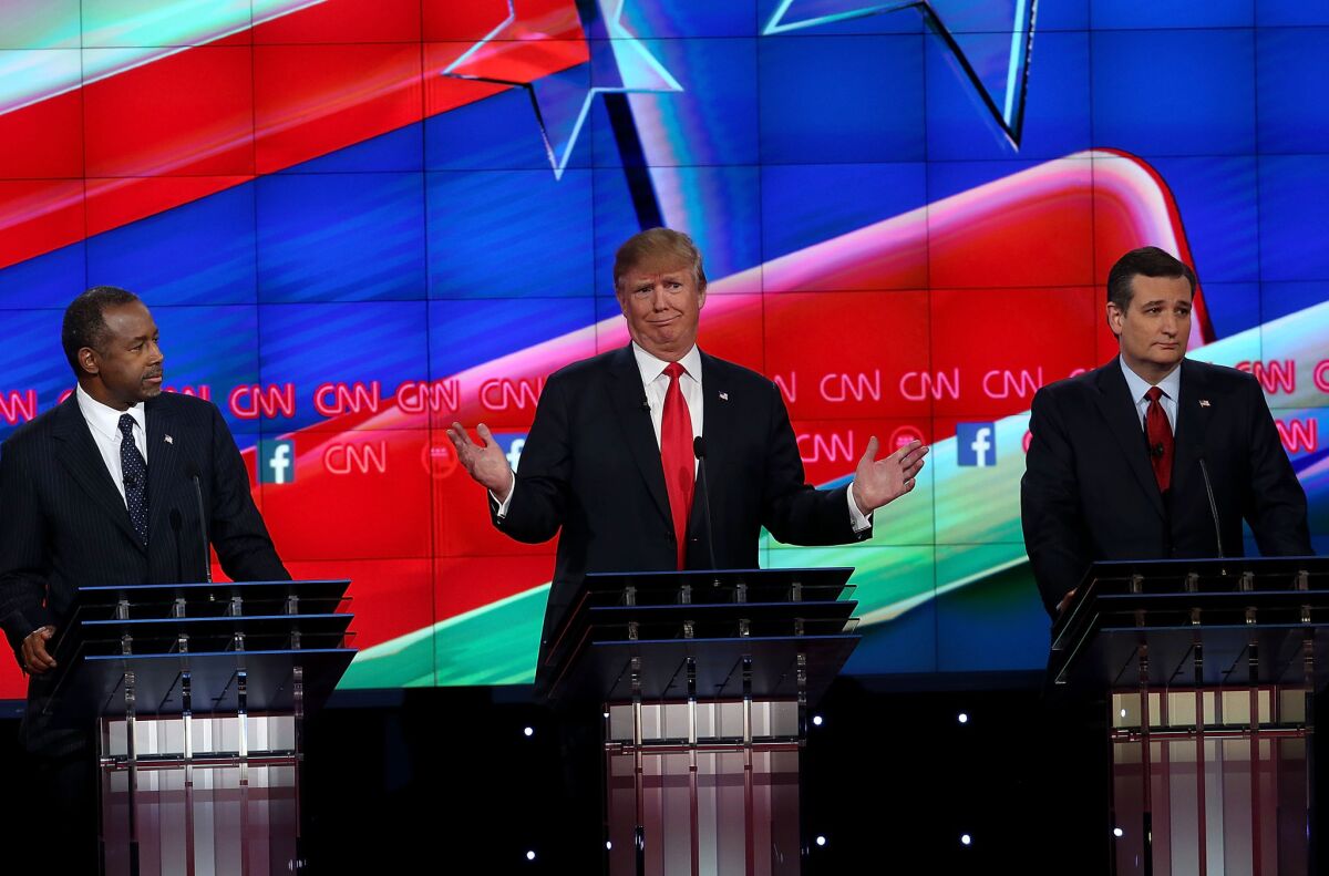 From left, Republican candidates Ben Carson, Donald Trump and Sen. Ted Cruz at the CNN presidential debate in Las Vegas.