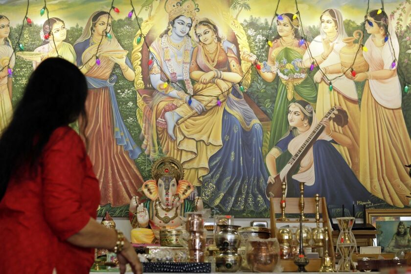 LOS ANGELES, CA -- MAY 10, 2019: A painting of Krishna decorates a wall at Samosa House in Los Angeles. The market/restaurant on Washington Boulevard is one of the oldest South Asian business in the Palms and Culver City area, opening as Bharat Market in 1979. (Myung J. Chun / Los Angeles Times)