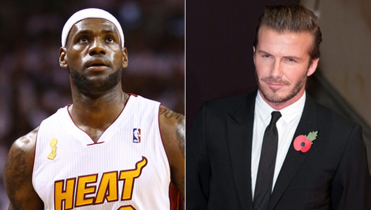 Miami Heat star LeBron James says he is in talks with soccer star David Beckham, right, to bring a Major League Soccer expansion team to South Florida.