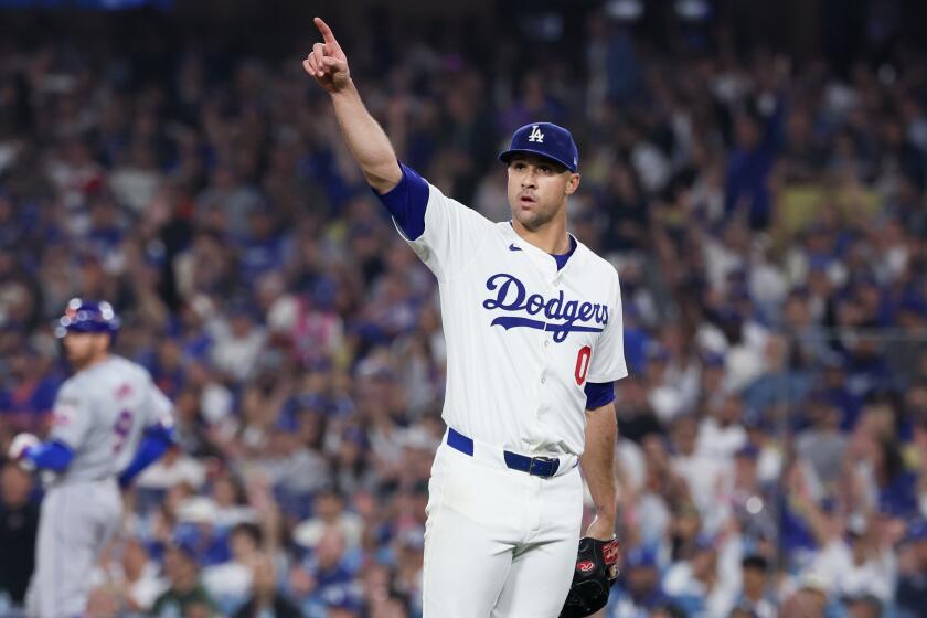 LOS ANGELES, CALIFORNIA - OCTOBER 13: Jack Flaherty #0 of the Los Angeles Dodgers points.