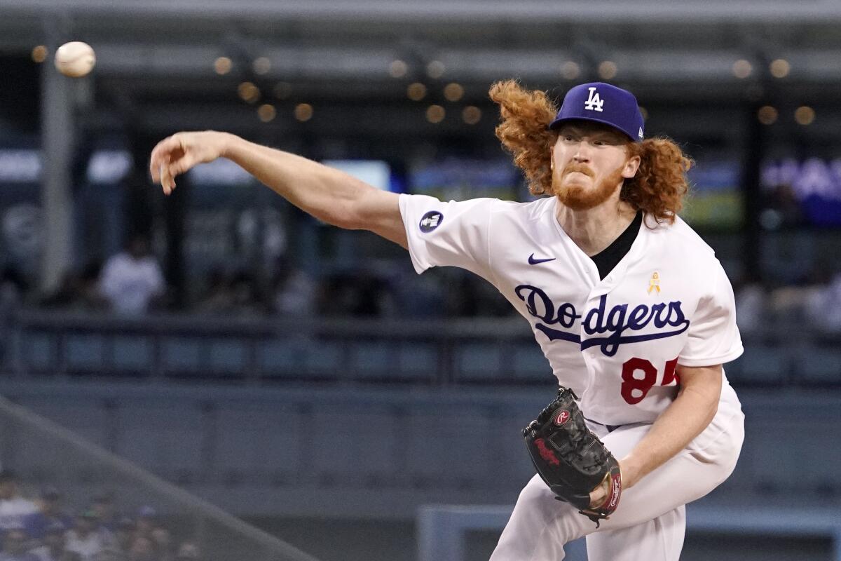 Los Angeles Dodgers starting pitcher Dustin May throws to the plate.