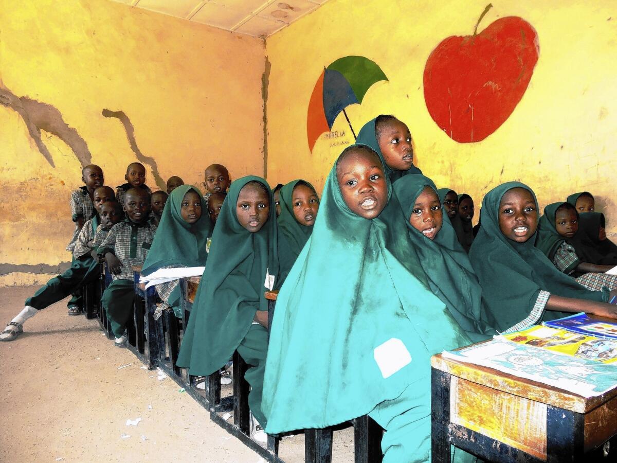 Children read from the Koran in a classroom in the northeastern Nigerian city of Maiduguri. The city is the epicenter of a brutal insurgency being waged by Boko Haram.