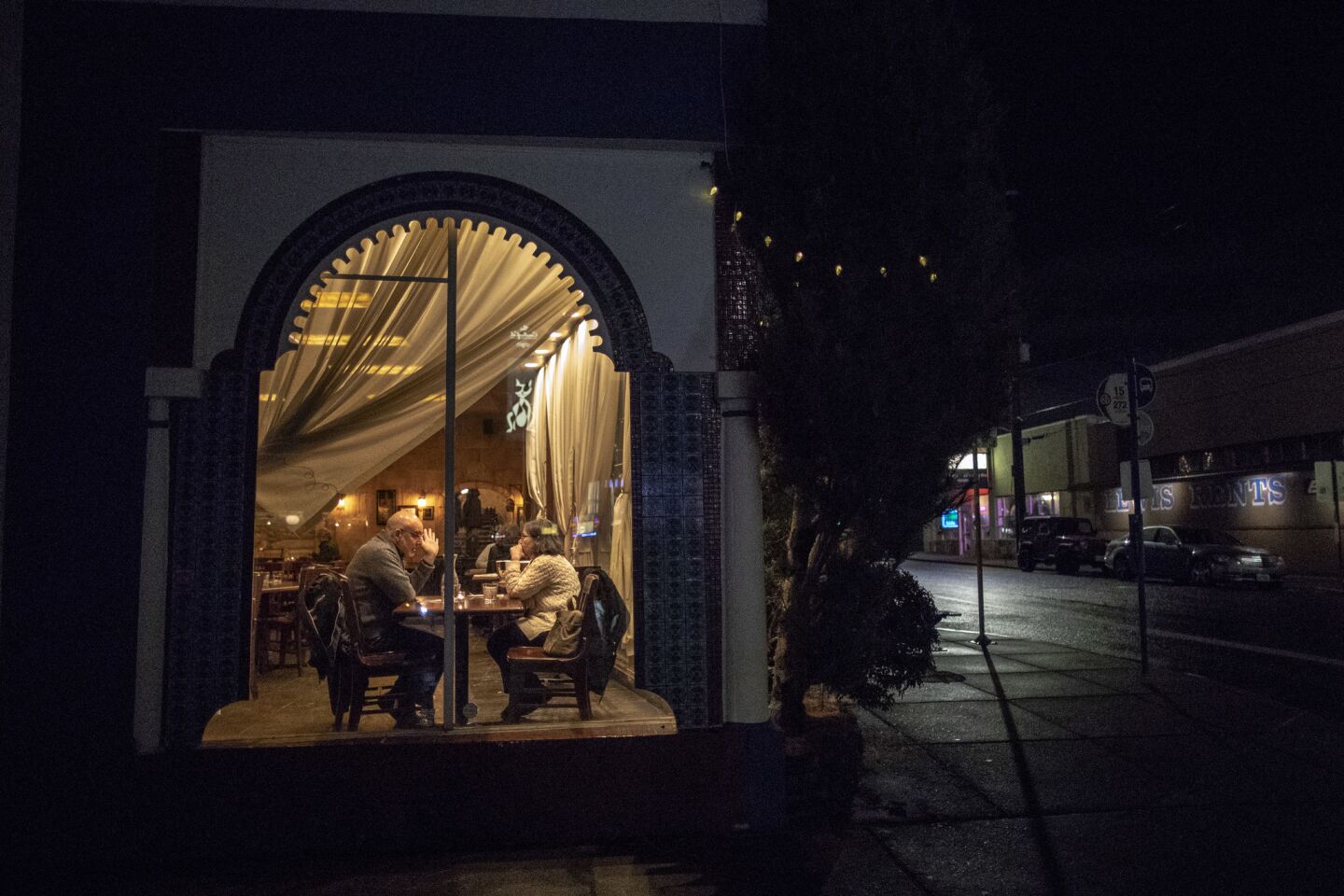 Diners sit at a table in an upscale restaurant on Stark Street in the Montavilla neighborhood in Portland, Ore.