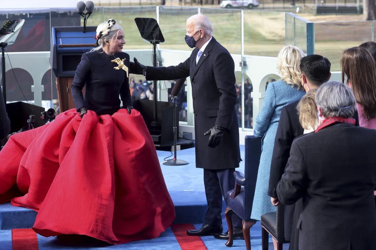 Lady Gaga is greeted by President-elect Joe Biden during his inauguration at the U.S. Capitol in Washington.