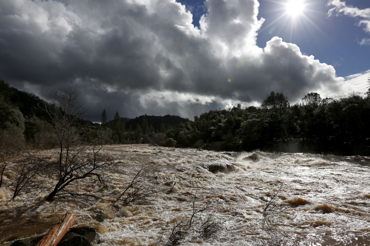 The Trouble Maker rapids on the American River in Coloma swell after a week of rains in Northern California.