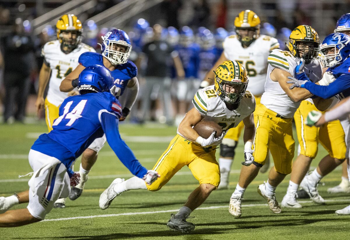 Edison's Troy Fletcher runs up field during a Sunset League game against Los Alamitos at Boswell Field on Thursday.