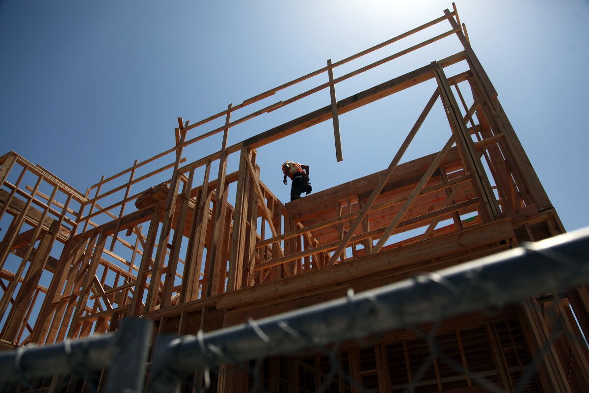 A worker at the construction site of an apartment complex
