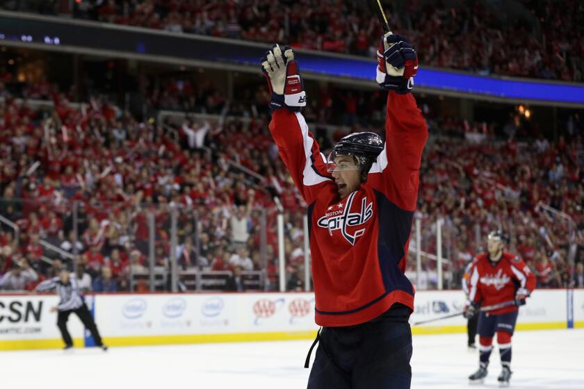 Forward T.J. Oshie (77) celebrates after scoring the game-winning goal to give the Capitals a 4-3 overtime win against the Pittsburgh Penguins in Game 1.