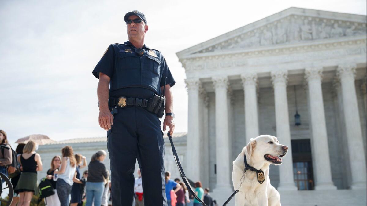 Police working in front of the Supreme Court in Washington on April 23.