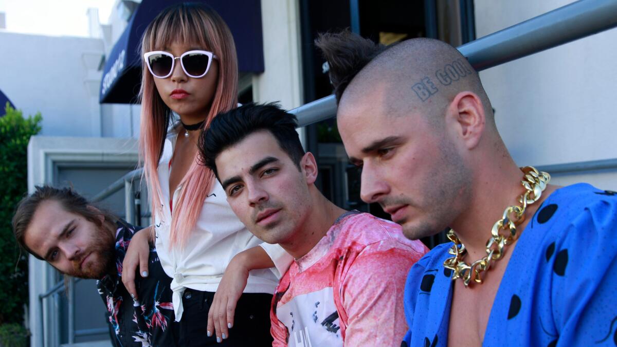 Jack Lawless, from left, JinJoo Lee, Joe Jonas and Cole Whittle of the band DNCE.