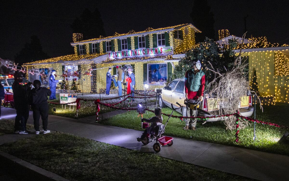 A house covered in lights and Christmas decorations