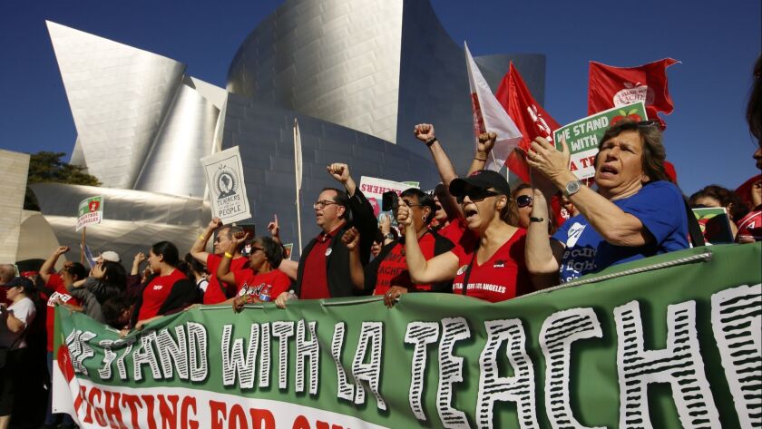 LAUSD teachers have rallied in large numbers, but their expected strike won't happen before next Monday. L.A. Unified hopes to push back that date through pending legal action.