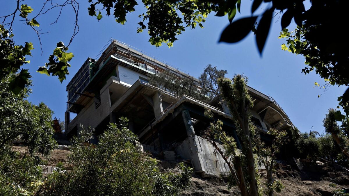 Three years ago, Los Angeles demanded that builders halt work on this mansion in the hills of Bel-Air. (Genaro Molina / Los Angeles Times)
