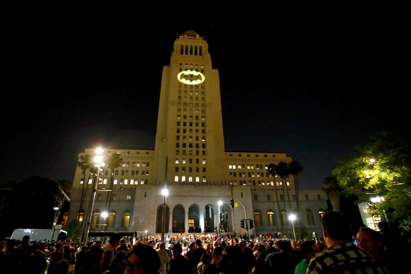 The Bat-signal is projected onto Los Angles City Hall during a tribute to pop-culture icon Adam West.