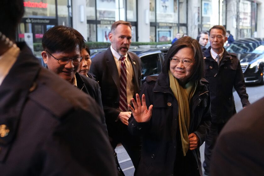 Taiwan's President Tsai Ing-wen waves as she arrives at a hotel, in New York, Thursday, March 30, 2023, a day before flying to Central America. Tsai’s stops in Guatemala and Belize are expected to shore up Taiwan’s partnerships there, after Honduras in mid-March switched its diplomatic relations from Taiwan to China. (AP Photo/John Minchillo)