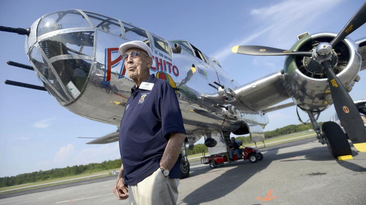 Former Doolittle Raider Richard Cole stands in front of a B-25 at the Destin Airport in Destin, Fla. during a reunion.
