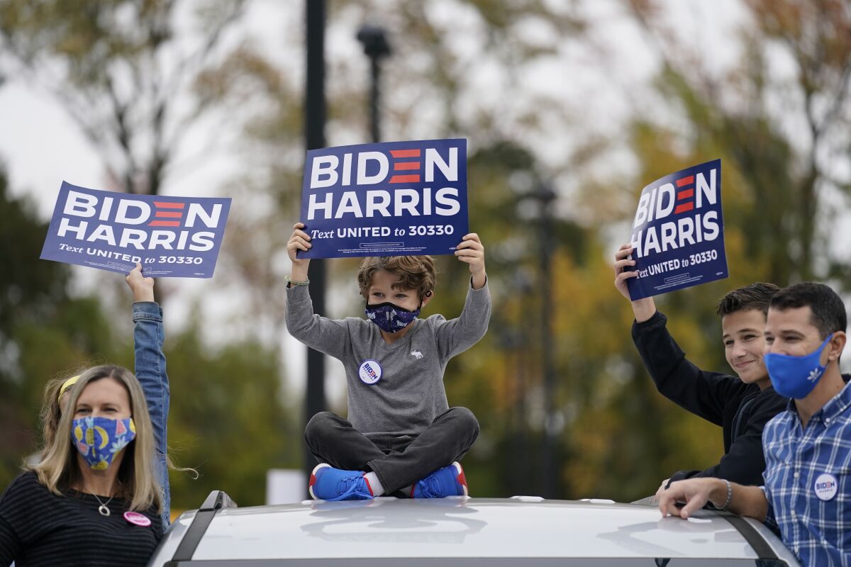 Supporters listen during a campaign stop for Joe Biden at Bucks County Community College, in Bristol, PA.