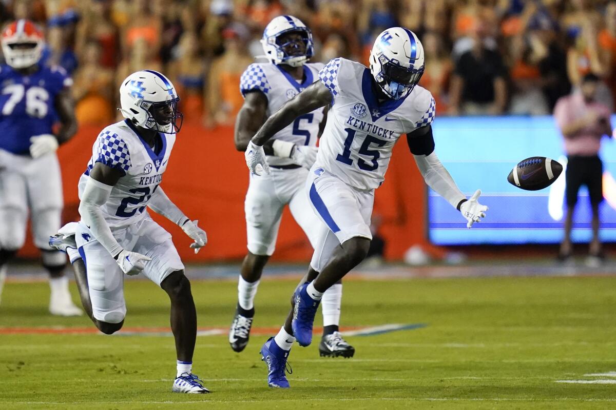 Kentucky linebacker Jordan Wright (15) goes after a tipped pass but can't get there to make the interception against Florida during the first half of an NCAA college football game Saturday, Sept. 10, 2022, in Gainesville, Fla. (AP Photo/John Raoux)